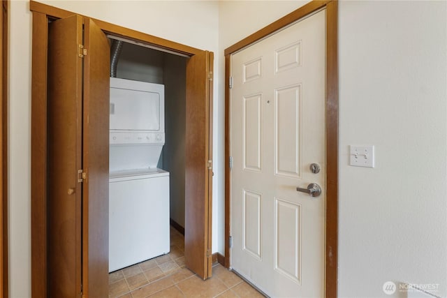 910 Gladstone St Unit 307, Bellingham, WA 98229 - laundry room with stacked washing machine and dryer and light tile patterned floors