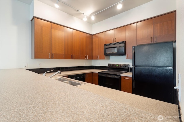 910 Gladstone St Unit 307, Bellingham, WA 98229 - kitchen with black appliances, a sink, track lighting, and light countertops