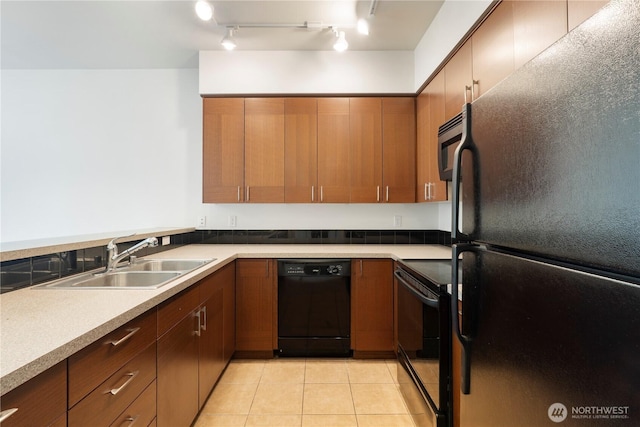 910 Gladstone St Unit 307, Bellingham, WA 98229 - kitchen with black appliances, a sink, light tile patterned flooring, and light countertops