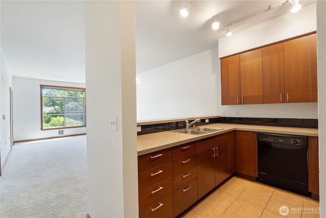 910 Gladstone St Unit 307, Bellingham, WA 98229 - kitchen with black dishwasher, a sink, light tile patterned floors, and rail lighting