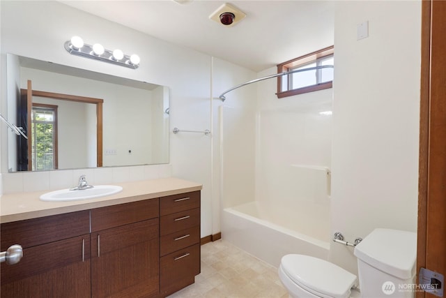 910 Gladstone St Unit 307, Bellingham, WA 98229 - bathroom featuring toilet, vanity, and shower / washtub combination