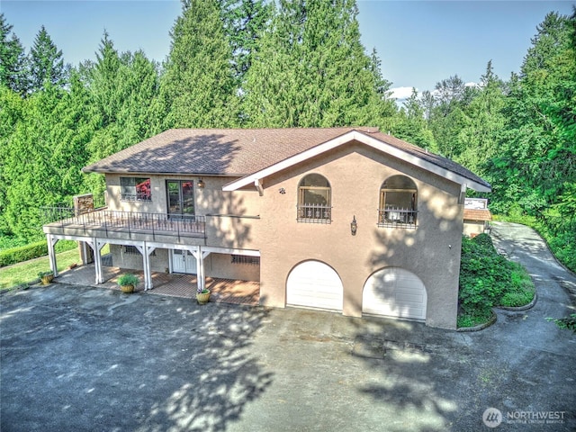 13311 SE 290th St, Auburn, WA 98092 - view of front of house with stucco siding, a garage, driveway, and a shingled roof