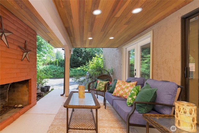 13311 SE 290th St, Auburn, WA 98092 - view of patio / terrace with an outdoor living space with a fireplace