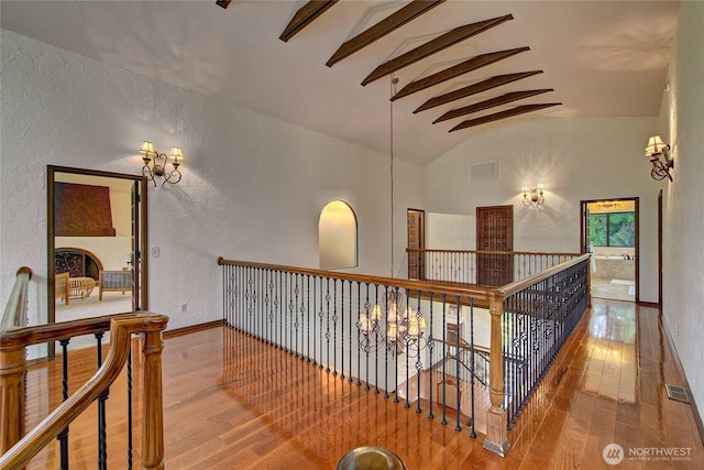 13311 SE 290th St, Auburn, WA 98092 - hall featuring hardwood / wood-style floors, a textured wall, baseboards, and an upstairs landing