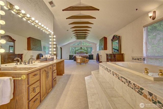 13311 SE 290th St, Auburn, WA 98092 - bathroom featuring a garden tub, vanity, and vaulted ceiling