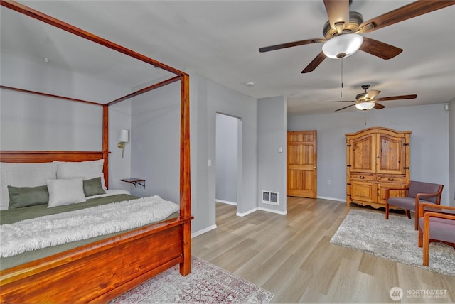 13311 SE 290th St, Auburn, WA 98092 - bedroom with wood finished floors, baseboards, and a ceiling fan