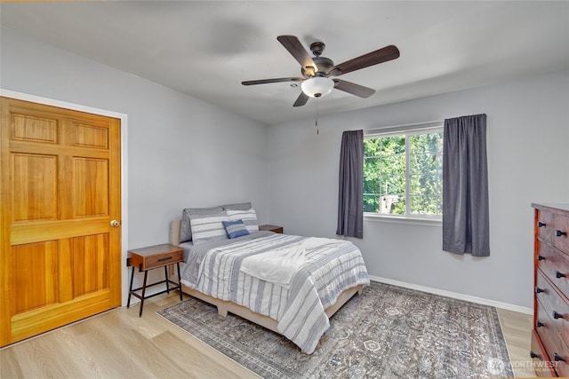 13311 SE 290th St, Auburn, WA 98092 - bedroom with wood finished floors, baseboards, and ceiling fan