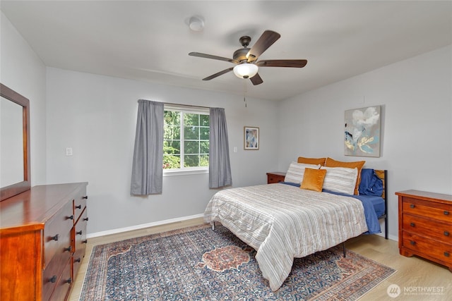 13311 SE 290th St, Auburn, WA 98092 - bedroom with light wood finished floors, ceiling fan, and baseboards