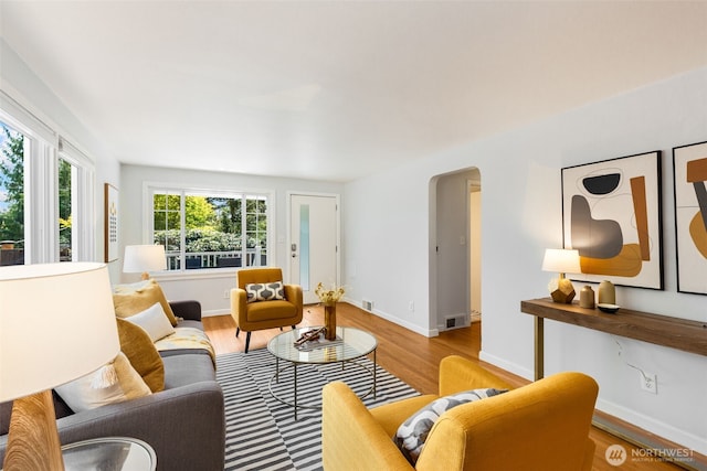 2330 NE 103rd St, Seattle, WA 98125 - living room featuring wood finished floors and arched walkways