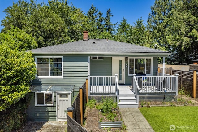 2330 NE 103rd St, Seattle, WA 98125 - bungalow with roof with shingles, a porch, and a chimney