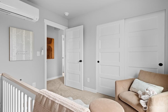 22226 76th Ave W Unit A5, Edmonds, WA 98026 - sitting room featuring a wall mounted AC, light carpet, and baseboards