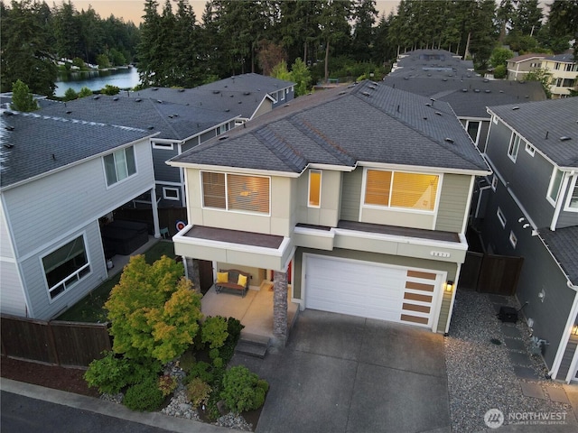 3071 S 276th Ct, Auburn, WA 98001 - view of front of house with an attached garage, roof with shingles, driveway, and view of wooded area