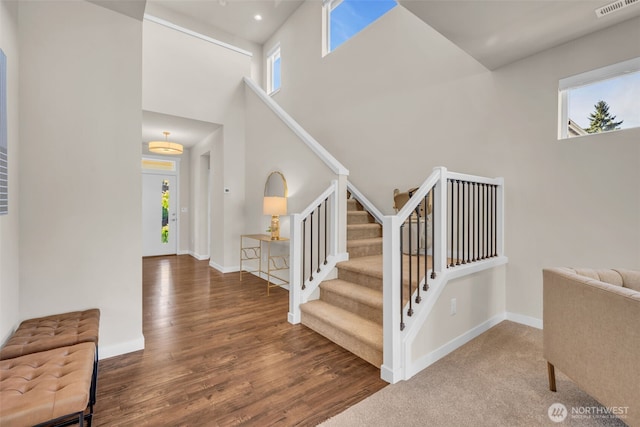 3071 S 276th Ct, Auburn, WA 98001 - foyer entrance with plenty of natural light, stairway, a high ceiling, and wood finished floors