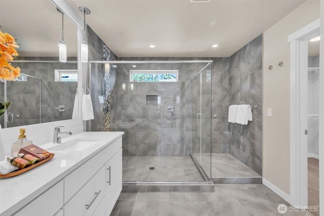 3071 S 276th Ct, Auburn, WA 98001 - bathroom with vanity, a stall shower, a walk in closet, recessed lighting, and tile patterned flooring
