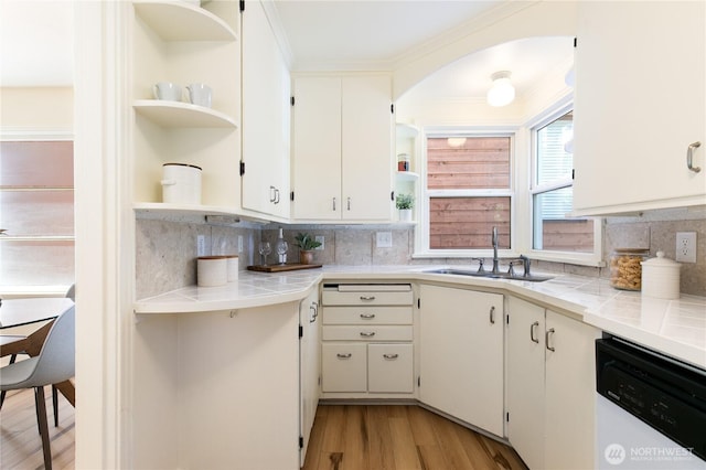 1536 NE 95th St, Seattle, WA 98115 - kitchen with open shelves, a sink, dishwashing machine, tile countertops, and tasteful backsplash