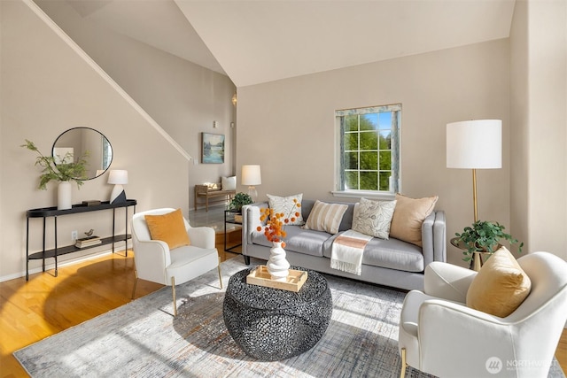 3316 Main Ave S, Renton, WA 98055 - living room with wood finished floors, vaulted ceiling, and baseboards