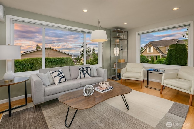 4439 158th Ave SE, Bellevue, WA 98006 - living room featuring wood finished floors, healthy amount of natural light, a wall unit AC, and recessed lighting