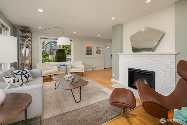 4439 158th Ave SE, Bellevue, WA 98006 - living room with wood finished floors, a brick fireplace, and recessed lighting