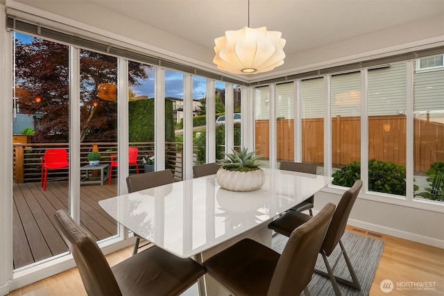 4439 158th Ave SE, Bellevue, WA 98006 - sunroom / solarium featuring wood finished floors and a chandelier