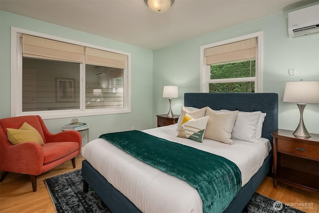4439 158th Ave SE, Bellevue, WA 98006 - bedroom with a wall mounted air conditioner and wood finished floors