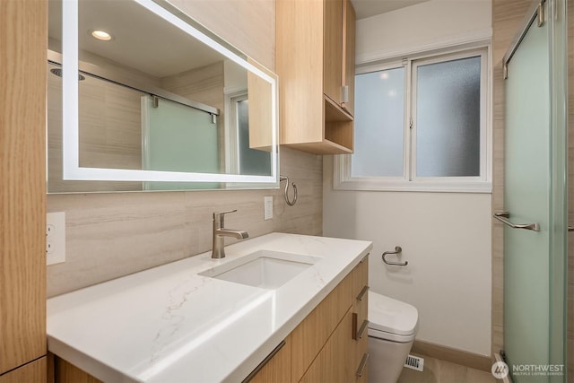 4439 158th Ave SE, Bellevue, WA 98006 - full bath with vanity, tasteful backsplash, and a shower with door