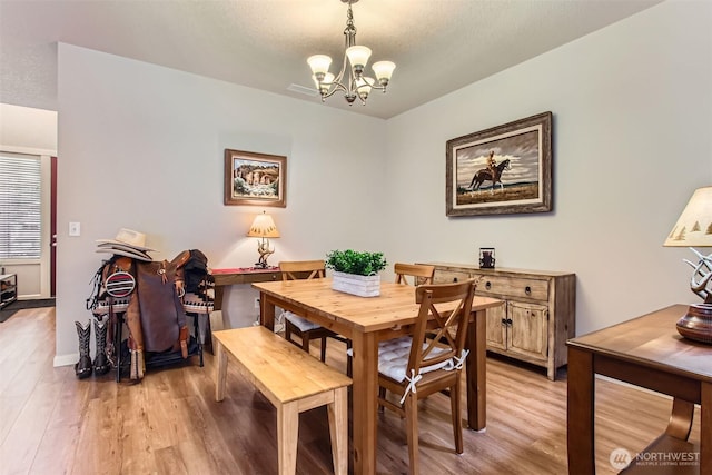 12911 NE 61st Ave, Vancouver, WA 98686 - dining room with a chandelier, light wood-style floors, and baseboards