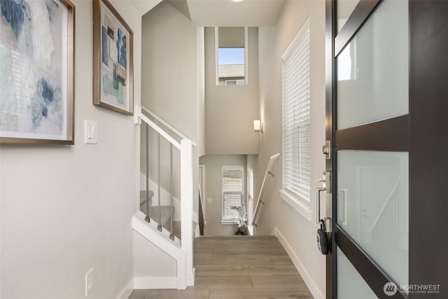 3123 148th St SW Unit A6, Lynnwood, WA 98087 - entryway with stairway, wood finished floors, and baseboards