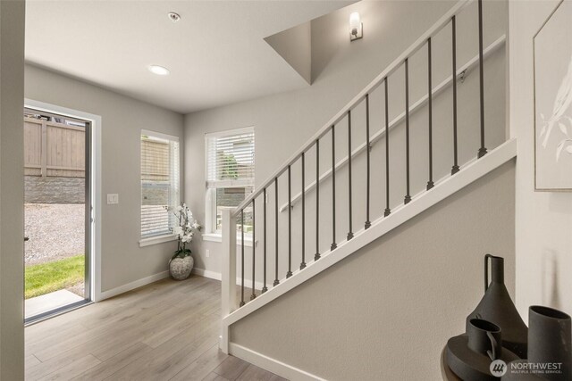 3123 148th St SW Unit A6, Lynnwood, WA 98087 - foyer with wood finished floors, baseboards, stairway, and recessed lighting