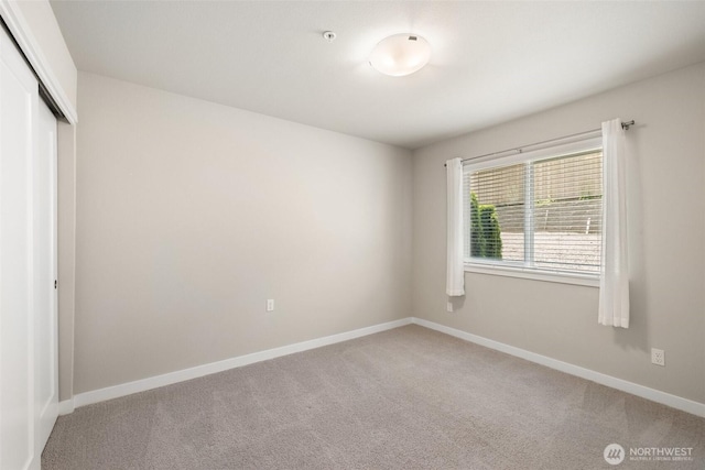 3123 148th St SW Unit A6, Lynnwood, WA 98087 - unfurnished bedroom with carpet, a closet, and baseboards