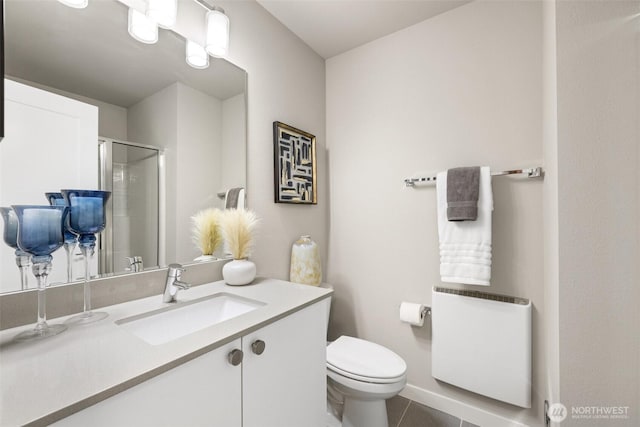 3123 148th St SW Unit A6, Lynnwood, WA 98087 - bathroom featuring toilet, vanity, a shower with door, and tile patterned floors