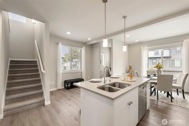 3123 148th St SW Unit A6, Lynnwood, WA 98087 - kitchen with a sink, dishwasher, light wood-style floors, pendant lighting, and recessed lighting