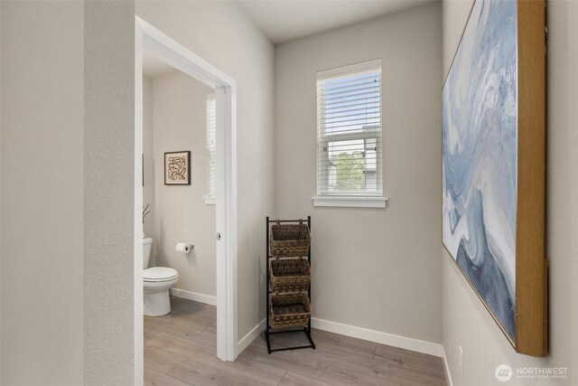 3123 148th St SW Unit A6, Lynnwood, WA 98087 - bathroom featuring toilet, wood finished floors, and baseboards