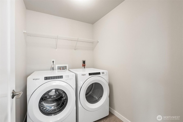 3123 148th St SW Unit A6, Lynnwood, WA 98087 - laundry room with washer and clothes dryer and baseboards