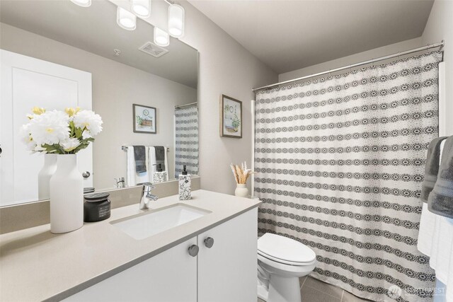 3123 148th St SW Unit A6, Lynnwood, WA 98087 - bathroom featuring vanity, toilet, tile patterned flooring, and a shower with shower curtain