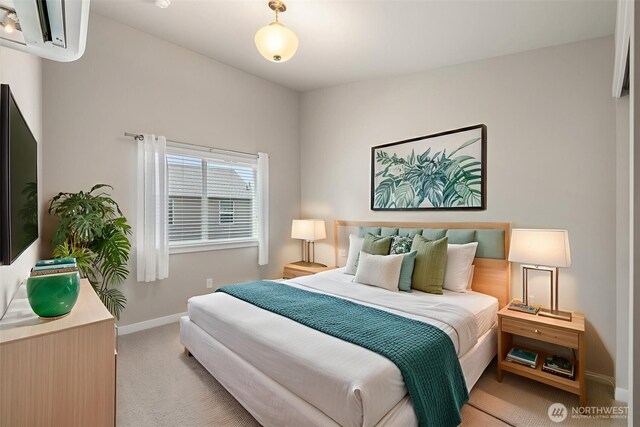 3123 148th St SW Unit A6, Lynnwood, WA 98087 - bedroom featuring light carpet, baseboards, and a wall mounted AC