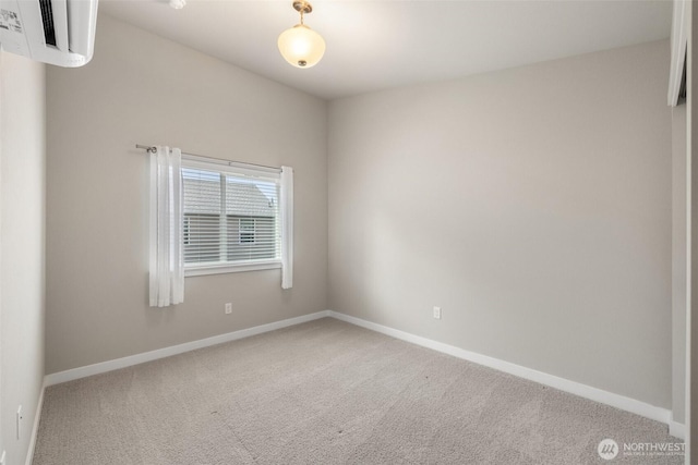 3123 148th St SW Unit A6, Lynnwood, WA 98087 - spare room featuring carpet floors, an AC wall unit, and baseboards