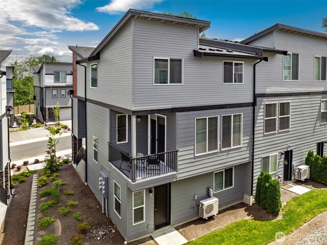 3123 148th St SW Unit A6, Lynnwood, WA 98087 - back of house featuring a cooling unit and a balcony