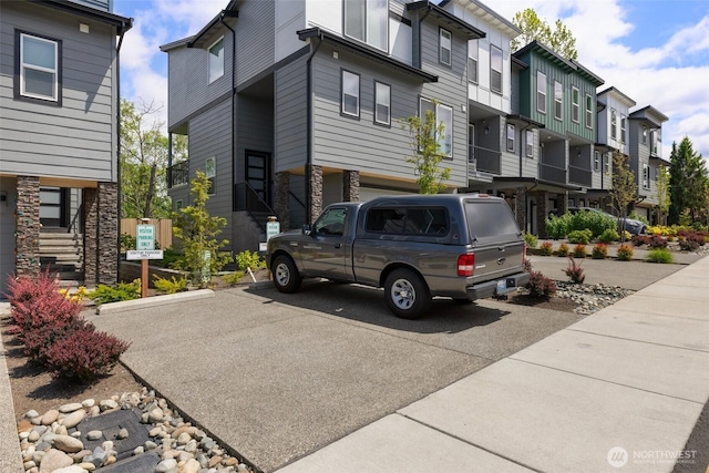 3123 148th St SW Unit A6, Lynnwood, WA 98087 - view of front of house with stone siding and a residential view