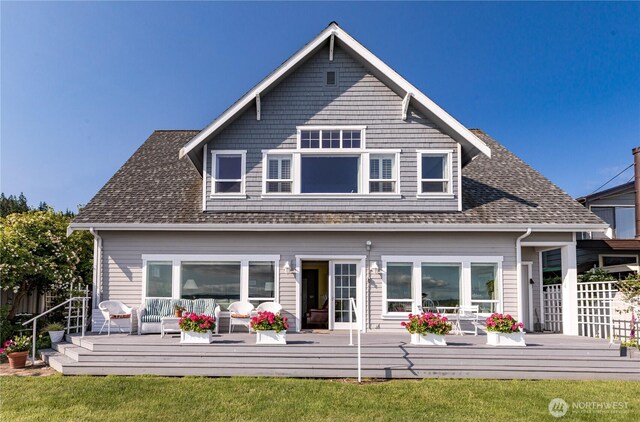817 Shorecrest Dr, Oak Harbor, WA 98277 - back of property with an outdoor living space, a deck, a shingled roof, and a lawn