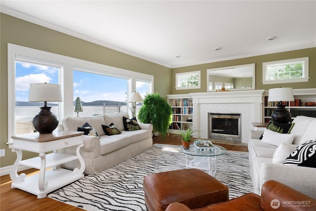 817 Shorecrest Dr, Oak Harbor, WA 98277 - living room featuring crown molding, wood finished floors, a fireplace, and baseboards