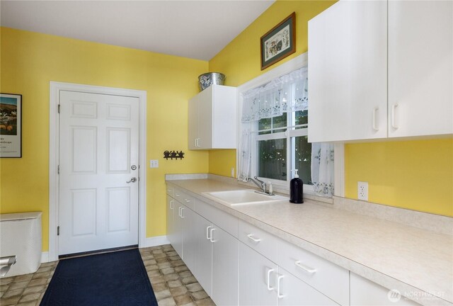 817 Shorecrest Dr, Oak Harbor, WA 98277 - kitchen featuring a sink, light countertops, and white cabinetry
