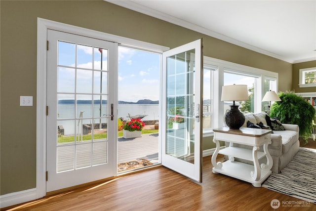 817 Shorecrest Dr, Oak Harbor, WA 98277 - entryway featuring crown molding, wood finished floors, a water view, and baseboards
