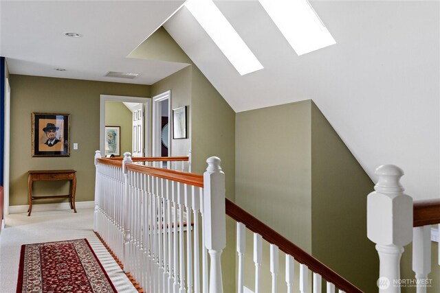 817 Shorecrest Dr, Oak Harbor, WA 98277 - hallway with an upstairs landing, a skylight, carpet floors, and baseboards