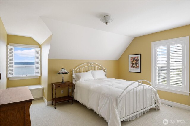 817 Shorecrest Dr, Oak Harbor, WA 98277 - bedroom with lofted ceiling, light carpet, and baseboards