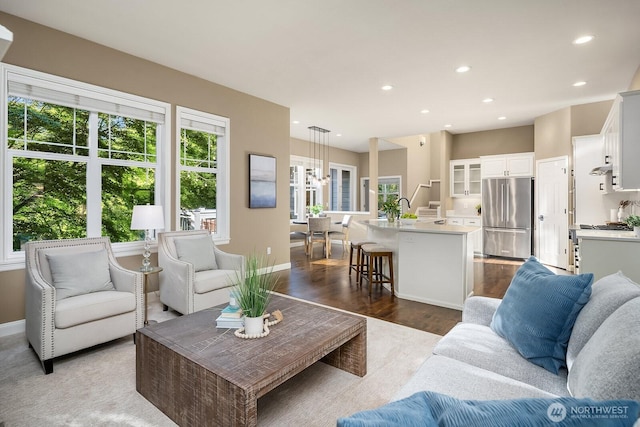 4503 229th Pl SE, Sammamish, WA 98075 - living room with recessed lighting, dark wood-style floors, and baseboards