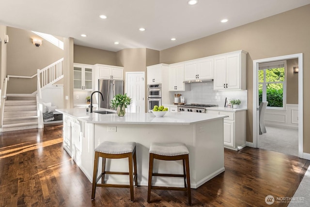 4503 229th Pl SE, Sammamish, WA 98075 - kitchen featuring a sink, appliances with stainless steel finishes, a large island, white cabinets, and recessed lighting