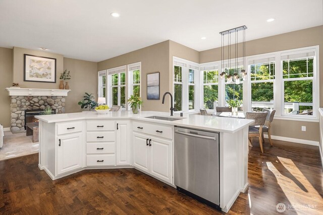 4503 229th Pl SE, Sammamish, WA 98075 - kitchen with stainless steel dishwasher, a sink, light countertops, dark wood-style floors, and recessed lighting