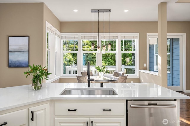 4503 229th Pl SE, Sammamish, WA 98075 - kitchen with dishwasher, a sink, white cabinets, wood finished floors, and recessed lighting