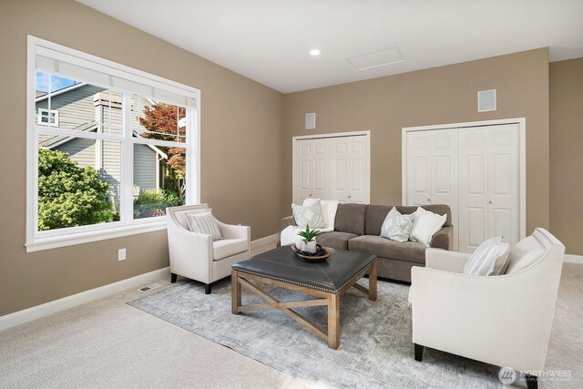 4503 229th Pl SE, Sammamish, WA 98075 - living room with light carpet, baseboards, and plenty of natural light