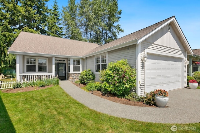 17747 Noble St SE, Monroe, WA 98272 - ranch-style home featuring an attached garage, driveway, a front yard, a shingled roof, and a porch